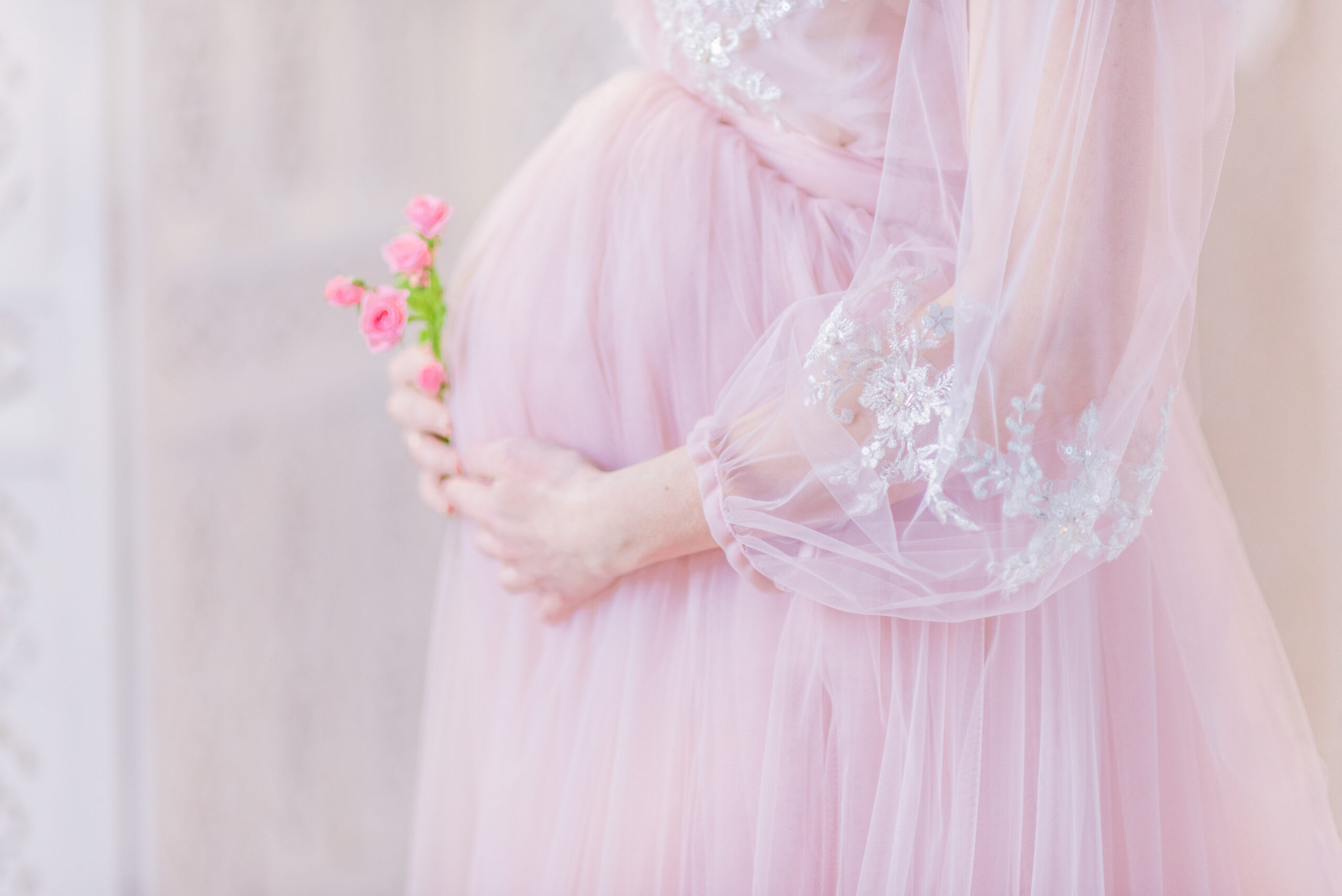 beautiful pregnant woman in rich pink dress holds hands on her b dompet dhuafa ibu hamil