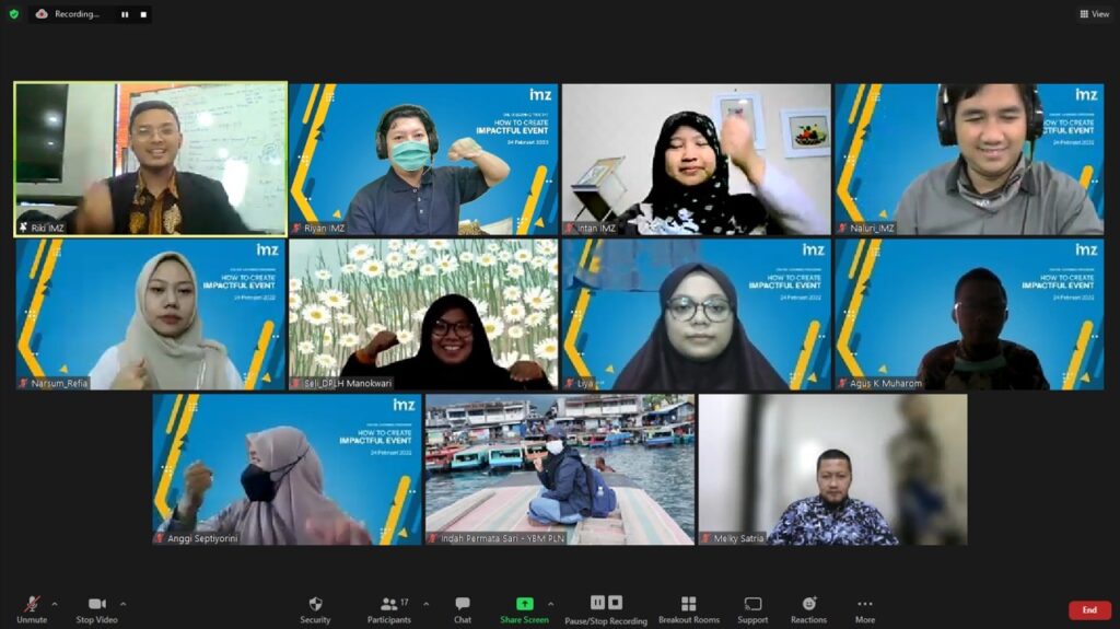 photo202202251506351 dompet dhuafa Zoom meeting with twelve participants in a grid; some wear headscarves, others wear masks, with blue branded backdrops in several tiles.