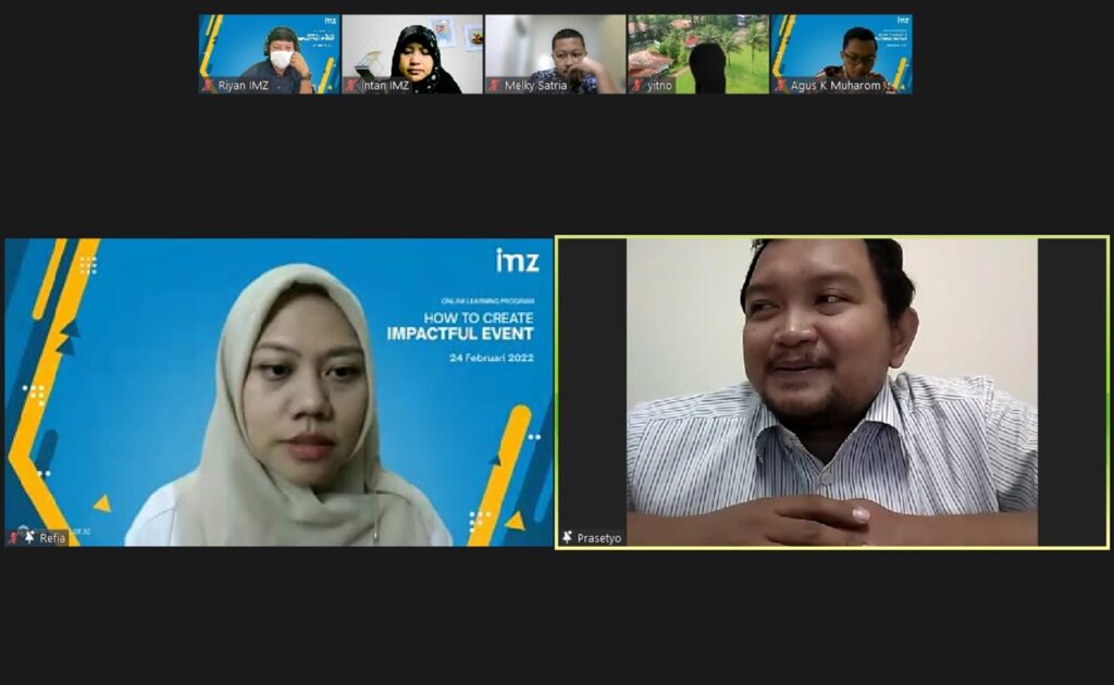 photo202202251506361 dompet dhuafa Two participants in a video conference: a woman in a beige hijab on the left, and a man in a striped shirt on the right in a separate video tile with a yellow border.
