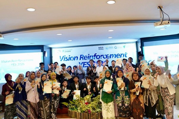 Group of participants on a stage holding certificates in front of a 'Vision Reinforcement' banner at a conference event.